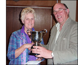 Beryl Slade recieves cup from Gordon Nicklin